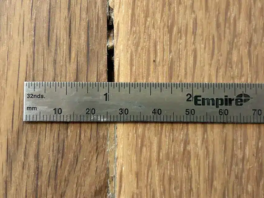 A separate inspection documented an opening and remaining filler along a refinished joint.