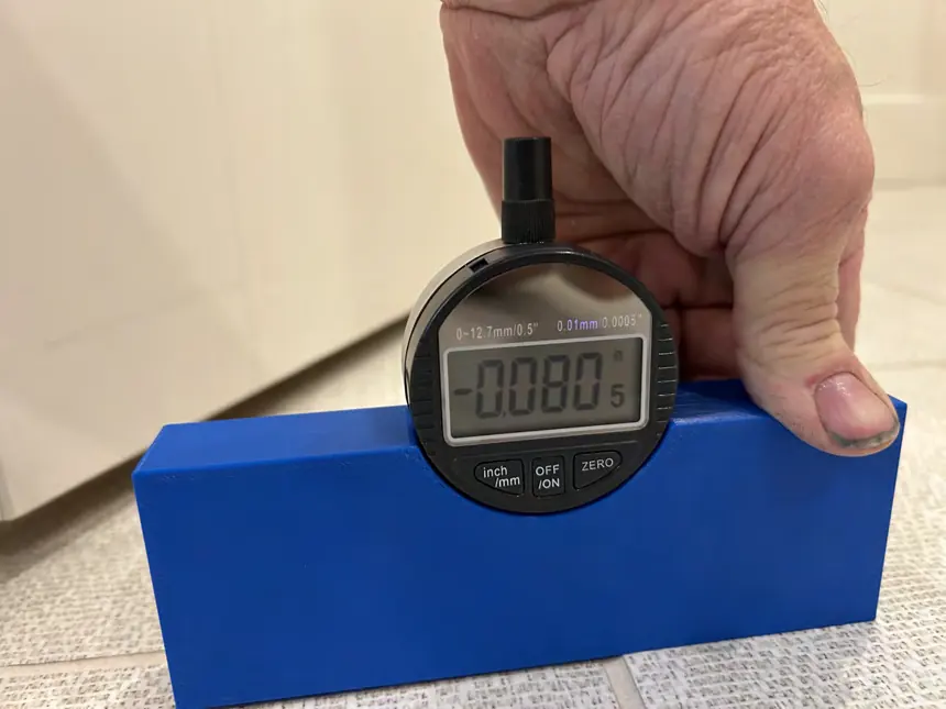 An actual tile inspection documenting lippage between neighboring tiles